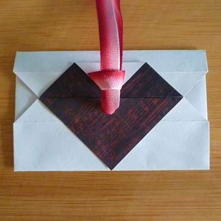Red and pink Ribbon fastening closure on handmade envelope